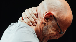 A person is experiencing neck pain