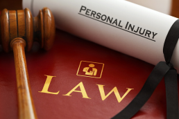 A legal concept image with a gavel, law book, and the words