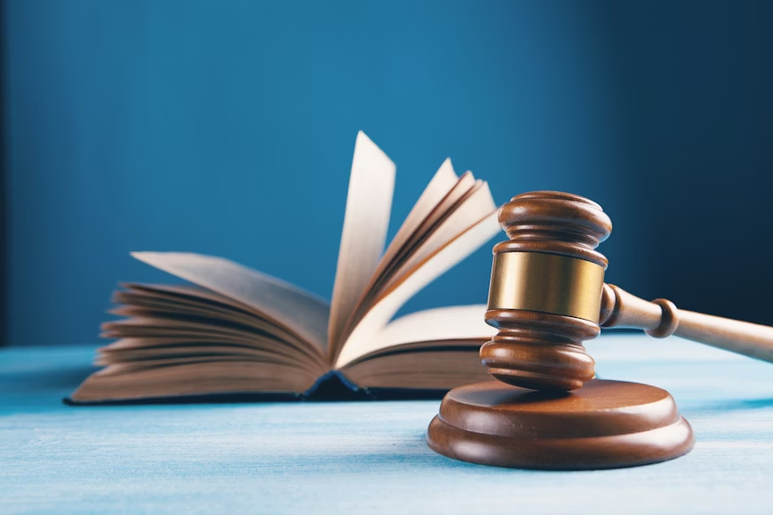 a book and a gavel on a table