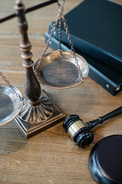 a gavel and a scale on a table